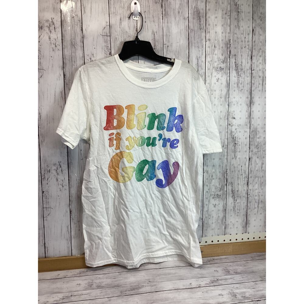 BUZZ T SHIRT “BLINK IF YOU’RE GAY” White M